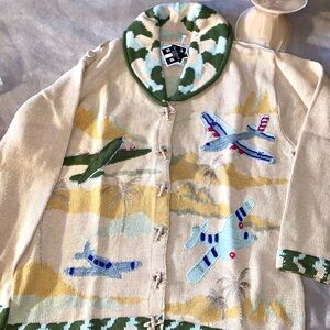 Vintage cardigan  by  Storybook Knits and features a whimsical airplane NEW
